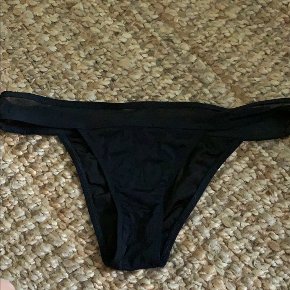 Mesh waist bikini cut swim bottoms.